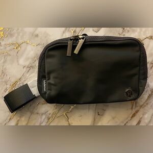 Dark grey lululemon cross-body belt bag. NWT